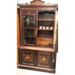 Edwardian rosewood inlaid bookcase, the shaped surmount marquetry inlaid with foliate scroll over