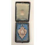 A cased Victorian silver watch fob medallion, maker WG JL, William Gibson & John Lawrence Langman,