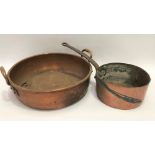 A copper preserve pan with twin handles, diameter 41cm; together with a copper saucepan with iron
