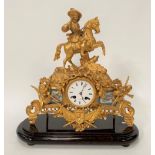 A gilt spelter two train mantel clock with porcelain panels, the 3.25in white enamel dial with black