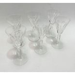 A set of six Waterford Crystal fluted glasses with half facet cut bowls and stems, height 14cm.