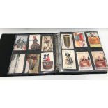 Modern postcard album containing 84 mailing novelty postcards with lift-up flaps and containing