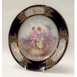 A Sevres cabinet plate painted and printed with a courting couple in 18th century dress, the rim
