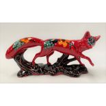 Anita Harris Pottery model of a fox, foliate decorated upon a red ground, printed marks to the base,