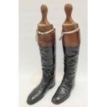 A good pair of black and tan leather gentlemans riding boots, with wooden trees, length of sole 12',