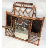 Victorian bamboo wall hanging mirror with lacquer panels, height 92cm x width 92cm.