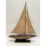 A model yacht upon stand, height 95cm.
