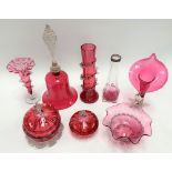 A collection of cranberry glass, to include a jack in the pulpit vase and a large bell.