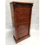 A Victorian walnut veneered Wellington chest with seven graduated drawers upon a plinth base, height