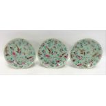 Set of three Chinese celadon glazed plates painted with birds and butterflies amongst foliage,