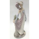 Lladro lady figure of a woman in an evening dress next to a column, height 34cm.