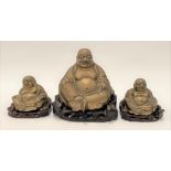 A large Chinese brass Buddha upon carved wood stand, height 16.5cm; together with a pair of