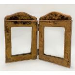 A Victorian brass and velvet covered double folding photograph frame, height 23cm.