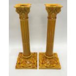 A large pair of Burmantofts faience yellow glazed Corninthian column candlesticks, No.1850, height