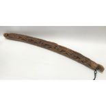 A possibly medieval carved wooden beam, carved with leaves, length 132cm.