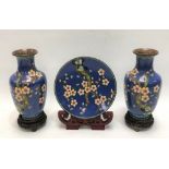 Pair of Chinese cloisonné baluster vases, decorated with blossoming prunus upon a powder blue ground