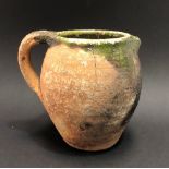 Early English earthenware jug, the rim with green drip glaze, height 15cm.