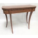 George III mahogany boxwood strung card table, the hinged lid green baize inset and on four sabre