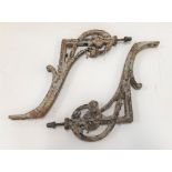 Pair of cast iron wall brackets, length 32cm.