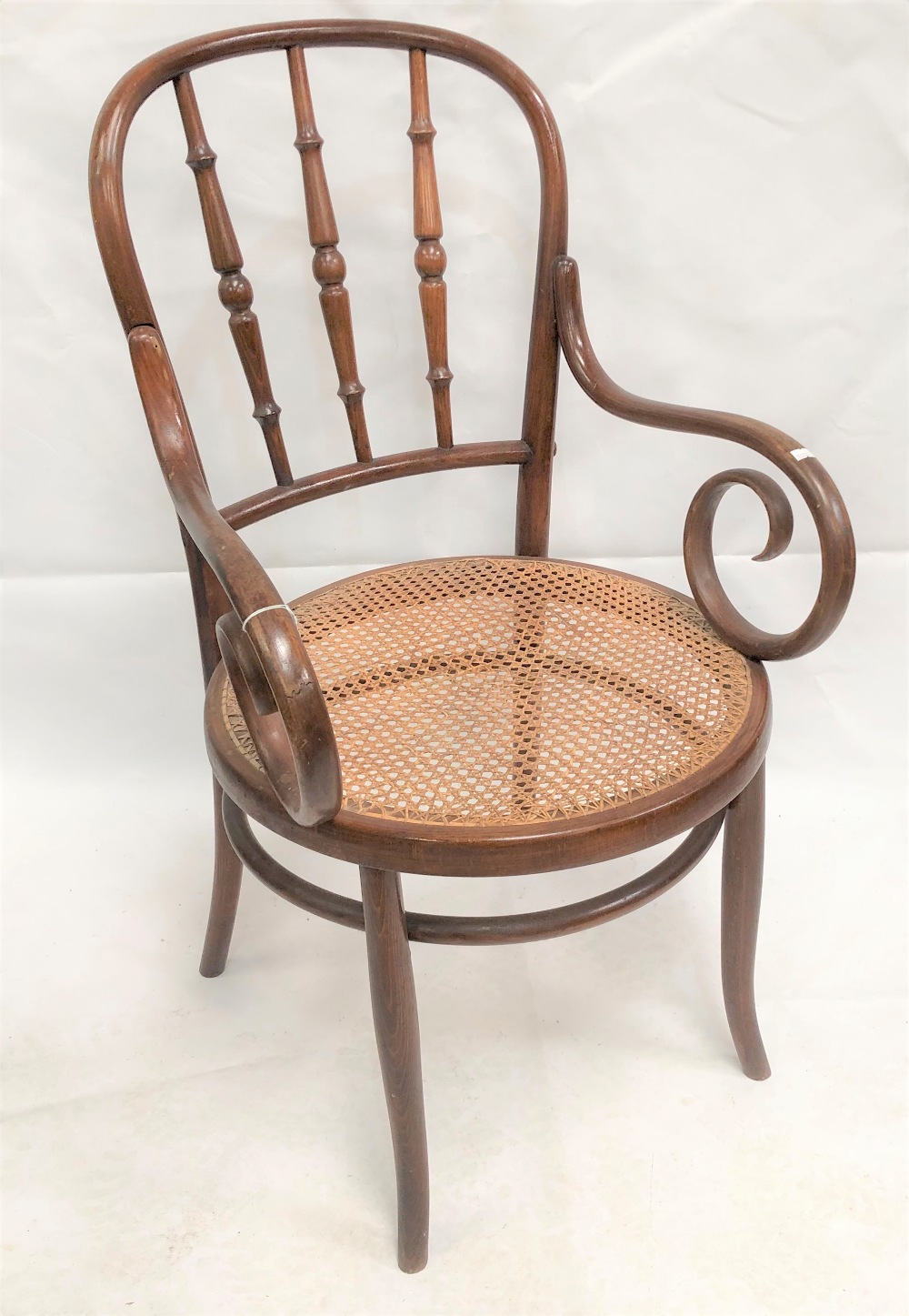 A cane seat bentwood elbow chair