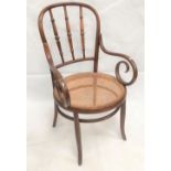 A cane seat bentwood elbow chair