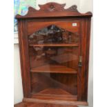 A mahogany wall hanging corner cabinet with glazed door, height 92cm