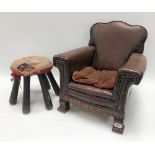 Early 20th Century child's brown stained canvas easy chair, height 42cm; together with a foot