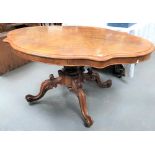 A Victorian burr walnut veneered tilt-top pedestal breakfast table, the oval serpentine shaped top