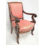 19th Century French mahogany elbow chair, circa 1840, with upholstered back and feet with outswept