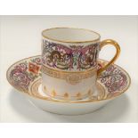 A Sevres Chateau De F.Bleau porcelain coffee can and saucer , the rims decorated with foliate