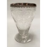 An Edwardian footed glass vase with wheel engraved foliate swag decoration and with silver rim,