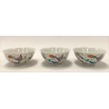 Set of three 20th Century Chinese porcelain bowls, each decorated with butterflies amongst foliate