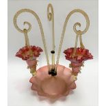A Victorian cranberry Vaseline glass three branch epergne, with two hanging baskets (one missing),