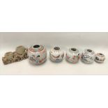 Five various Chinese famille rose ginger jars, the largest height 13cm and a soapstone carved spill.