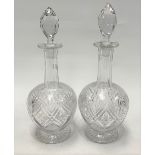 A pair of Webb cut crystal decanters and stoppers, height 30cm.