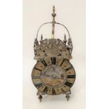 A brass cased lantern clock with two-train movement striking on a gong, the 6in dial signed Amomette