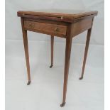 An Edwardian walnut inlaid envelope card table with baize interior over a single drawer with