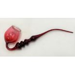 Victorian cranberry glass large decorative pipe, the ovoid bowl with white opaque glass rim,