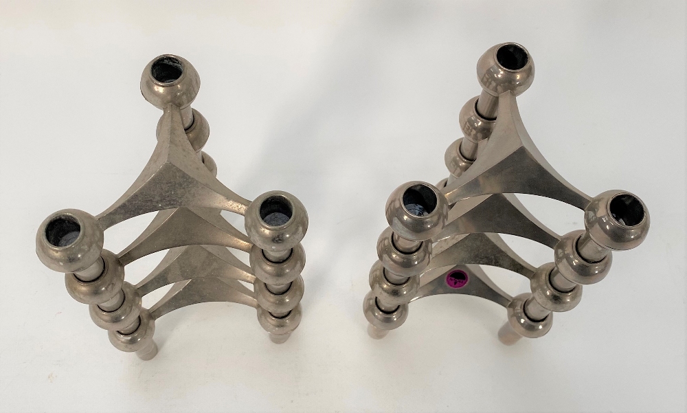 A pair of Stoff Nagel, nickel, four stacking, three section candlesticks, one with original paper - Image 2 of 2