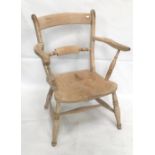 A 19th century elm seat elbow chair.