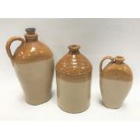 Three stoneware storage jars, one with advertising for ARTHUR W. DAVEY WINE AND SPIRIT MERCHANT