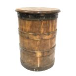 A rustic coopered barrel with later oak lid to make a table, height 58cm x width 43cm