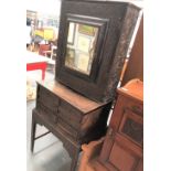 Antiques style oak cabinet with mirrored door upon stand with three drawers and the base with square