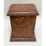 A Victorian oak drop front stationery cabinet with inkwell, height 25cm.