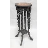 Chinese octagonal section hardwood carved two tier jardinière stand, the octagonal top with marble
