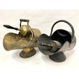 A Victorian brass foliate scroll embossed coal helmet and scoop, together with a copper coal