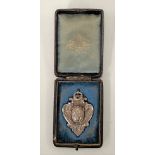 A cased Victorian silver watch fob medallion, maker WG JL, William Gibson & John Lawrence Langman,