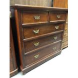 An early 20th century mahogany straight front chest of two short over three long drawers, over a