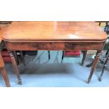 A 19th Century mahogany tea table raised on four ring turned tapering legs, width 105cm