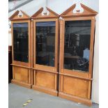 A set of three Lord David Linley oak fronted and inlaid bookcases, each with broken arch pediments